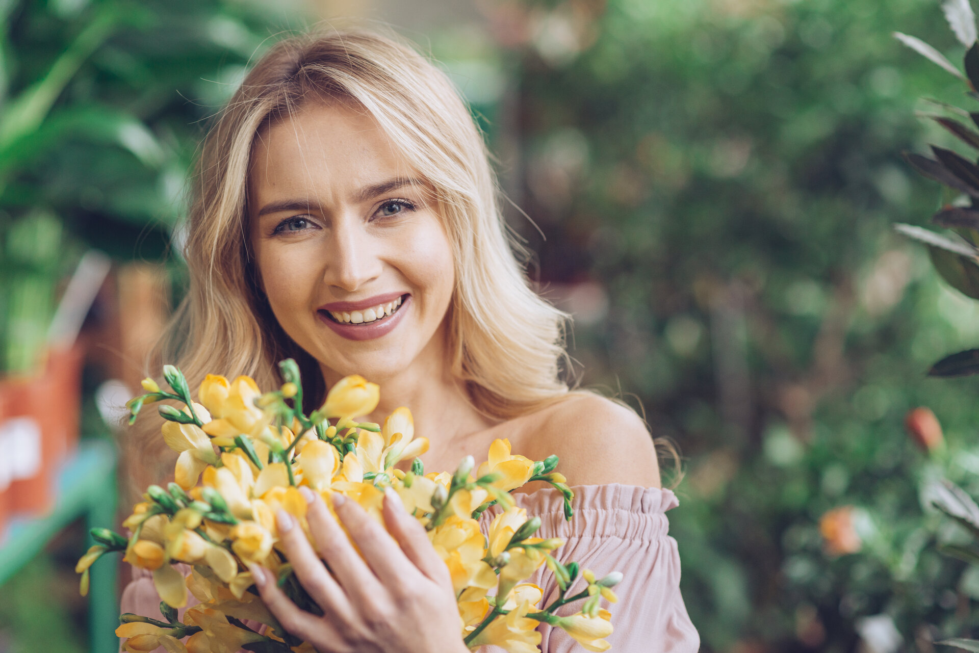 straight teeth blonde hair young lady with flowers