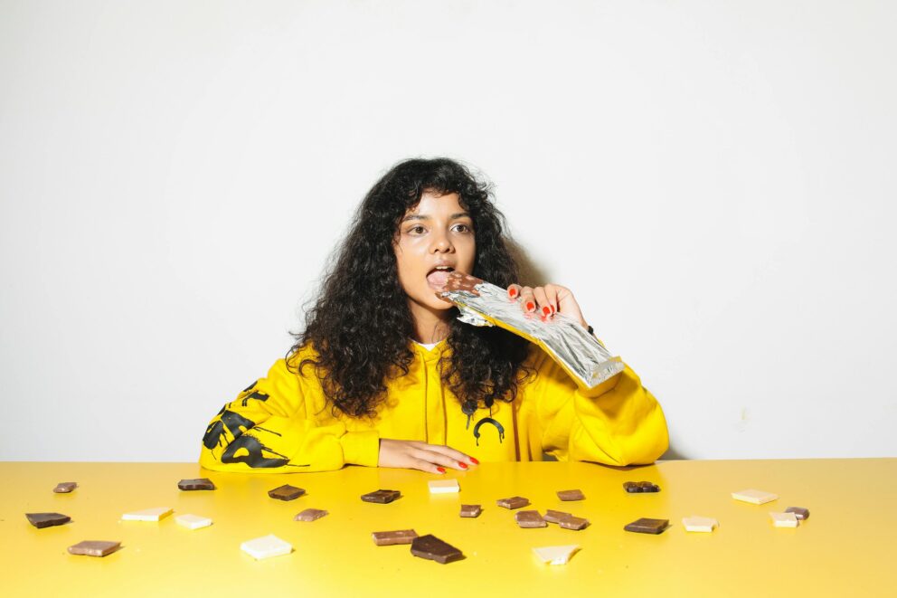 woman eating chocolate before dental waldorf md appointment