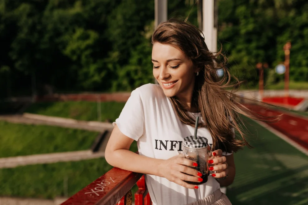 rsz_dreaming-happy-woman-wearing-white-t-shirt-drinking-morning-coffee-walking-sunny-street-with-happy-smile
