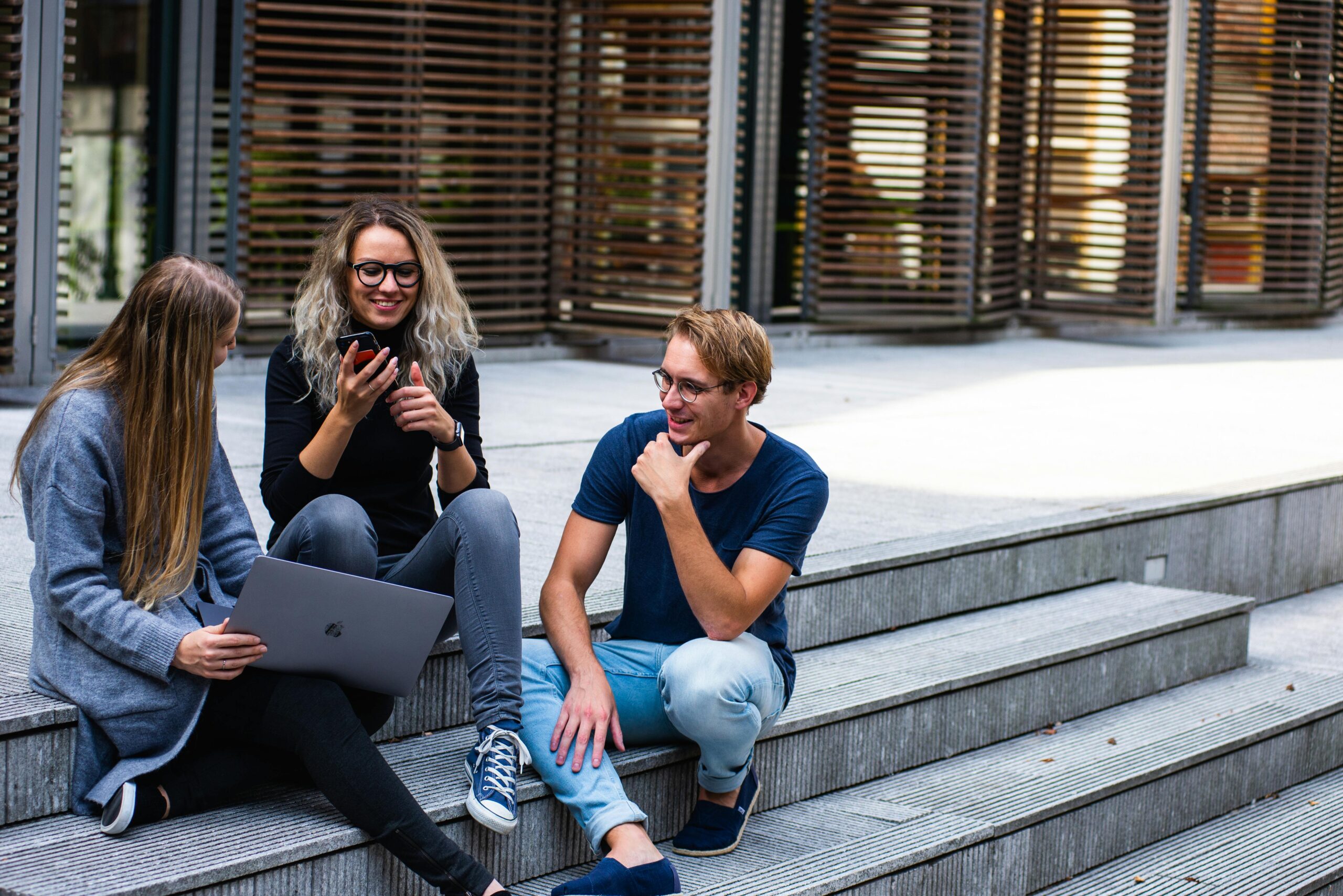 group of friends hanging out on steps before scheduling teeth whitening Waldorf, MD
